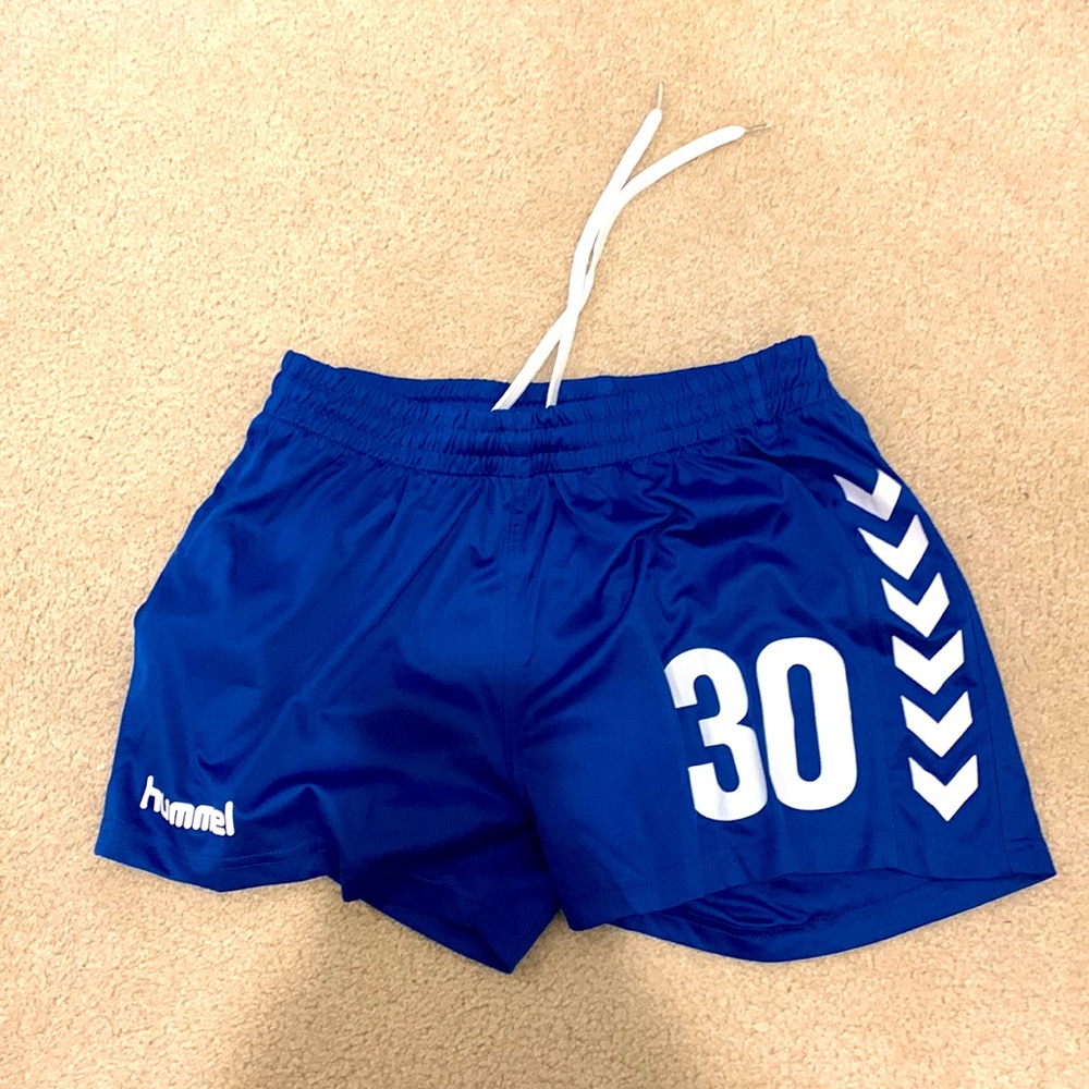 Four pairs of Hummel soccer shorts.
